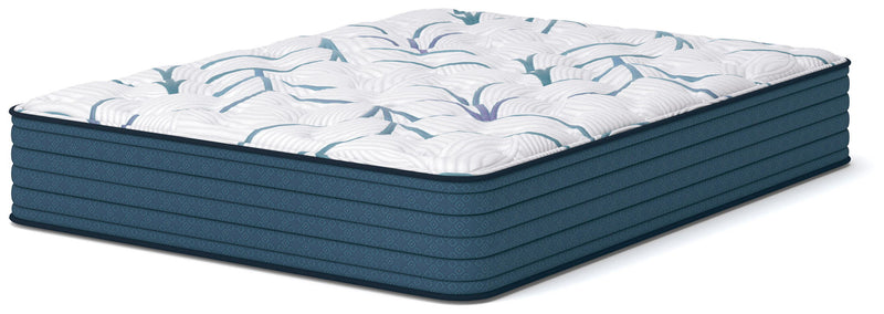 Plush mattress with white quilted top and light blue curved pattern, side view