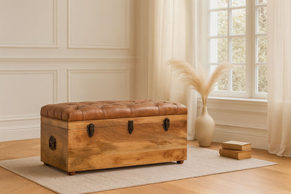 Brown wooden storage trunk with padded tan lid and three black latch handles
