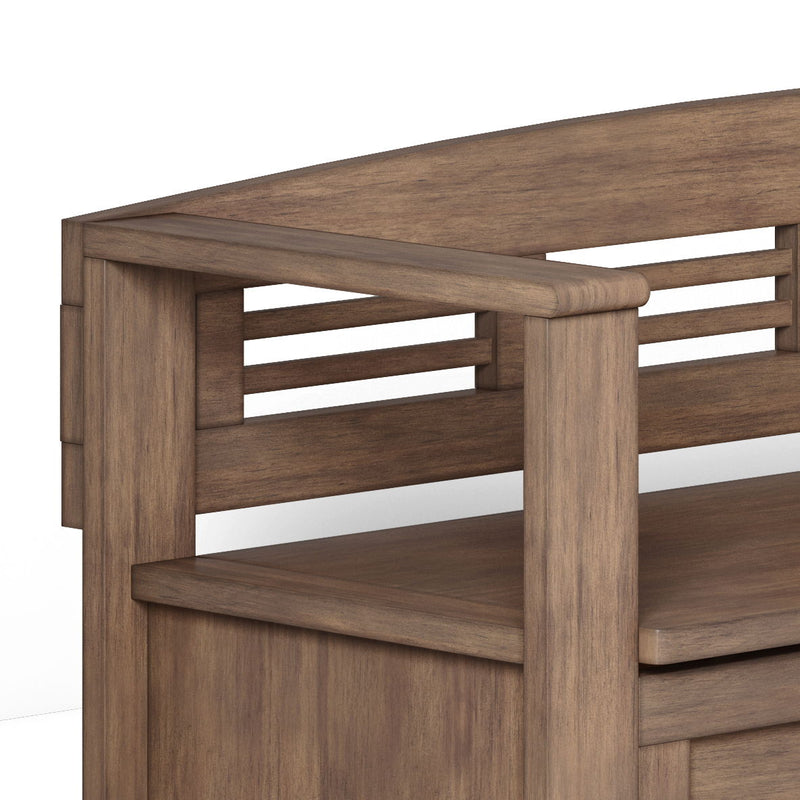 Close-up of dark brown wooden entryway storage bench with slatted side panel and shelf.