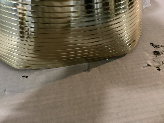 Gold-tone ribbed pedestal base on packaging, tapered cone shape