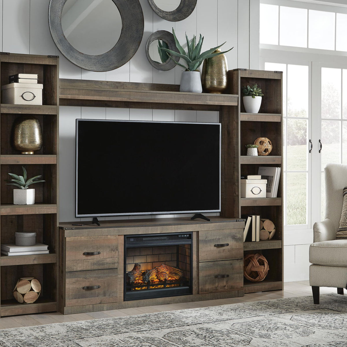 Dark brown entertainment center with TV opening, shelves, and fireplace insert