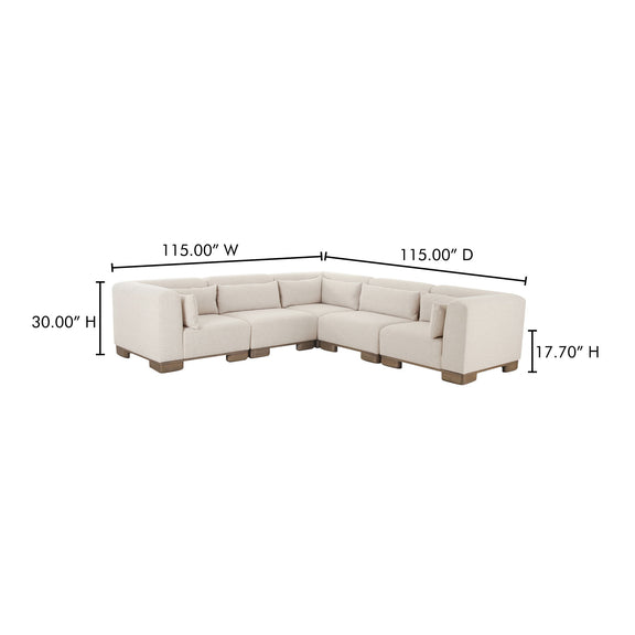 L-shaped sectional sofa in oatmeal fabric with corner chaise and dark wood block feet.