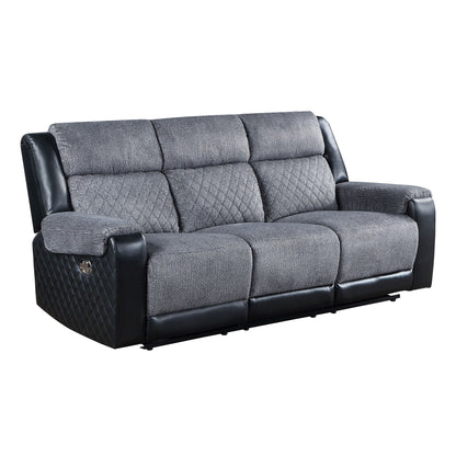 Gray reclining sofa with quilted side panels, padded arms, and split back cushions