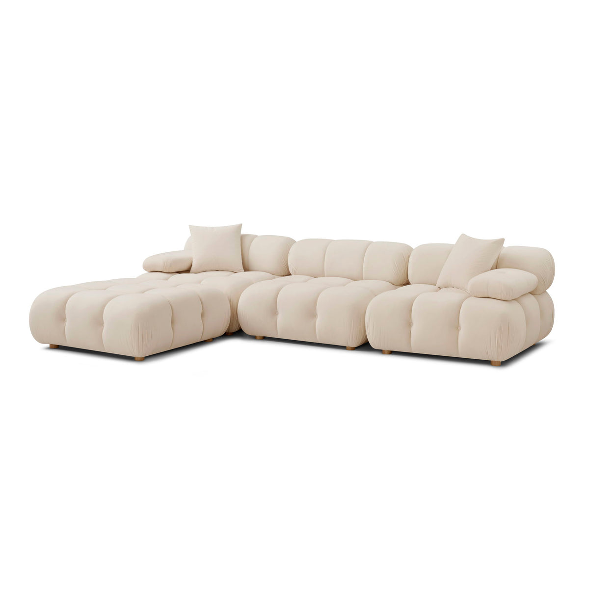 White modular sectional sofa with tufted cushions and two back pillows