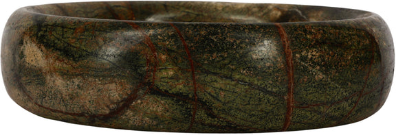 Dark green marble round tray side view with textured veining along the edge.