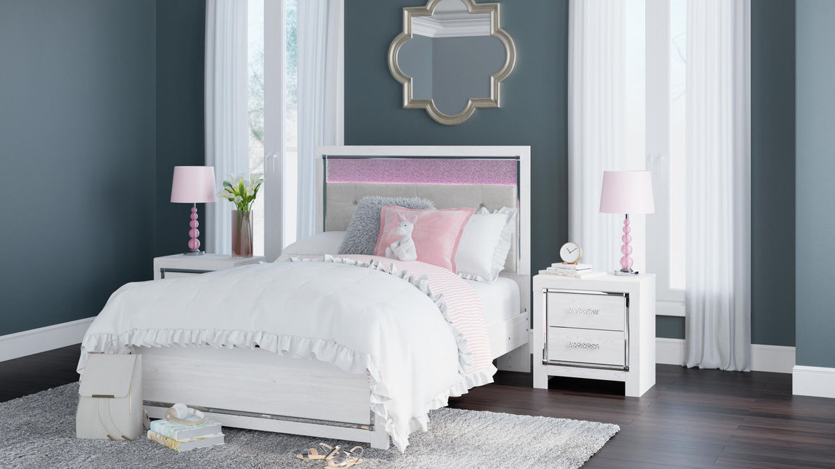 White panel bed with tufted headboard and drawer storage, styled with bedding