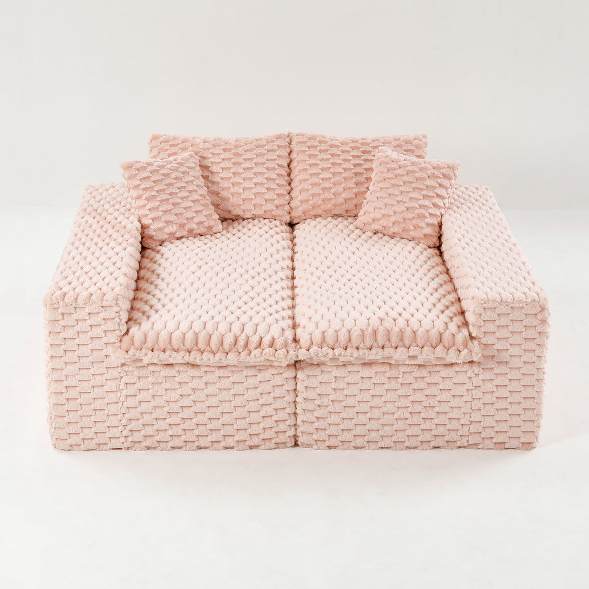 Multifunctional sofa in light pink, two-seat style with tufted armrests and back cushions.