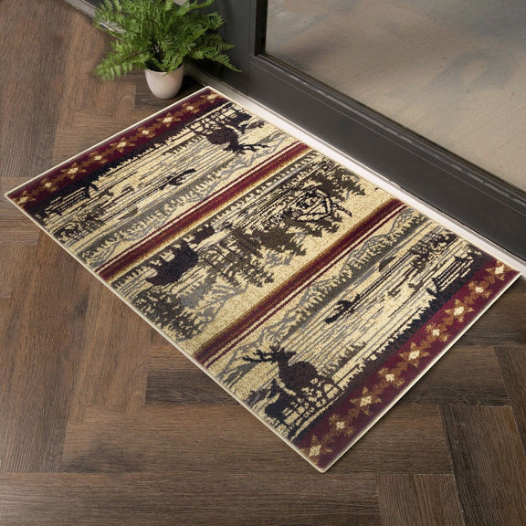 Beige lodge area rug with detailed black tree and animal scene, burgundy border stripes