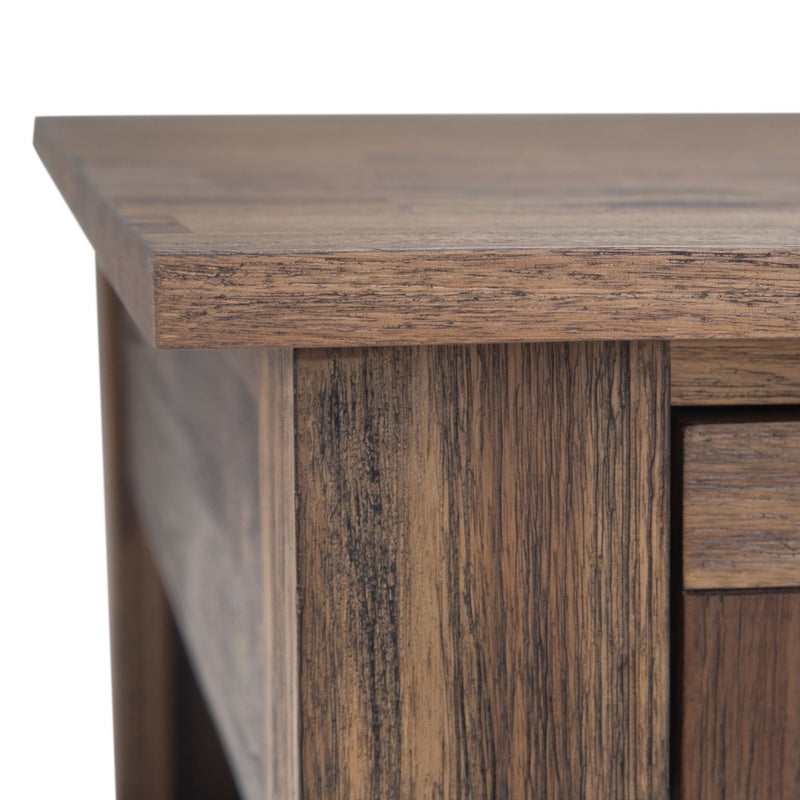 Close-up of wood grain on a dark side table drawer and cabinet frame