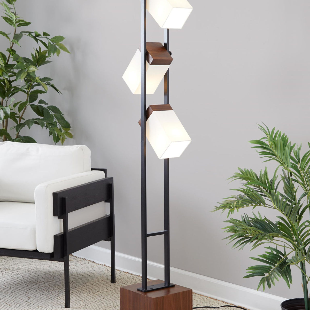 Black floor lamp with two visible white cube shades and walnut square pedestal base