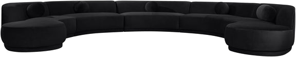 Black performance velvet sectional sofa with rounded arm sections and tufted cushions