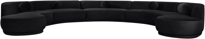 Black performance velvet sectional sofa with rounded arm sections and tufted cushions