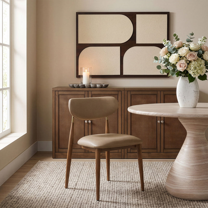 Beige vegan leather dining side chair with walnut legs and button details