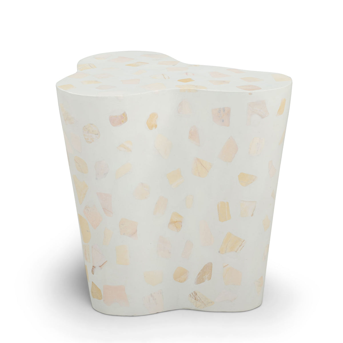 Light beige side table with terrazzo pattern and rounded top surface