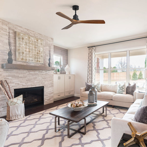 Wood three-blade ceiling fan installed above a living room seating area