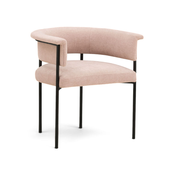 Light pink upholstered dining chair with rounded seat, curved arms, and black legs
