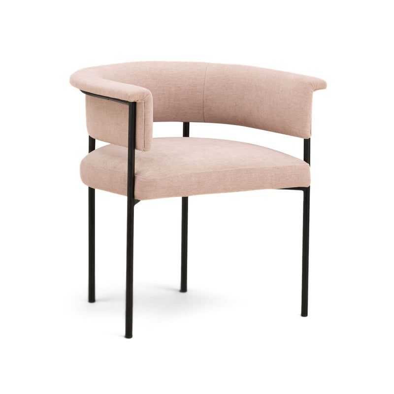 Light pink upholstered dining chair with rounded seat, curved arms, and black legs