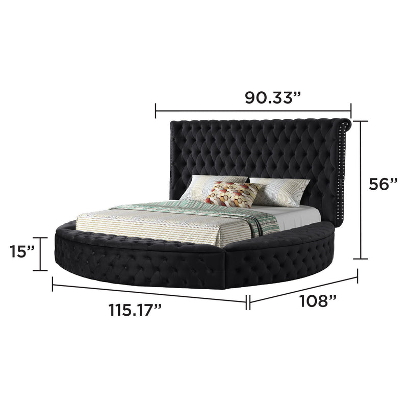 Black tufted storage bed with tall headboard, curved foot, and fitted slats
