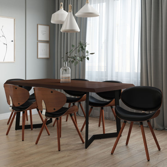 Black faux leather dining chair with curved back, seat, and arched wooden legs