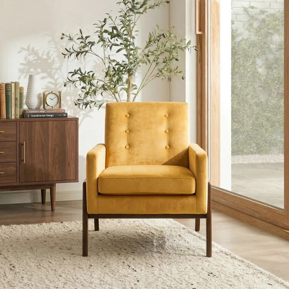 Yellow upholstered lounge chair with tufted back, padded arms, and solid wood legs.
