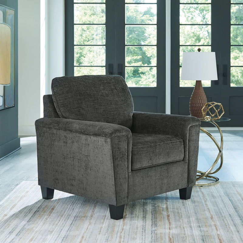 Upholstered armchair with dark gray textured fabric, deep seat and padded arms