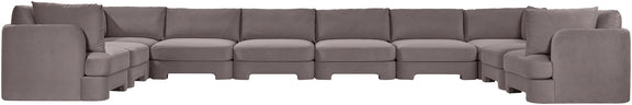 Light gray velvet sectional sofa with modular seating and padded back cushions