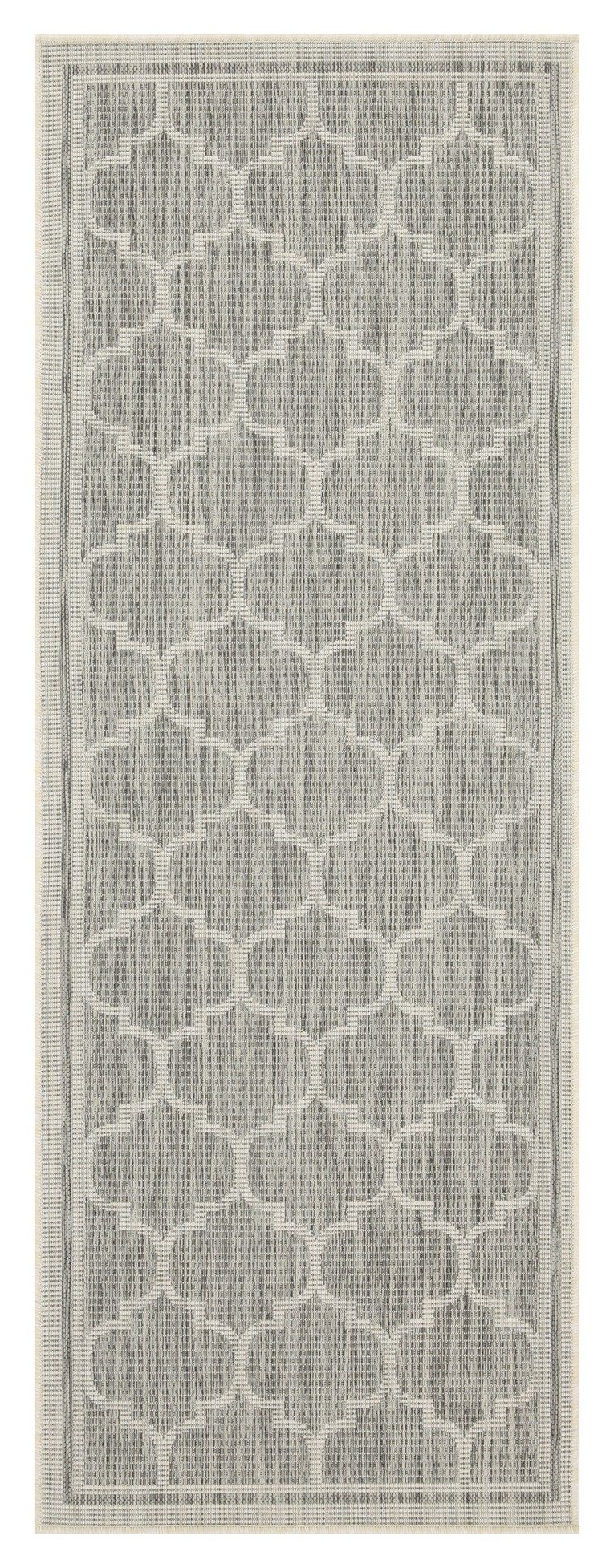 Light gray polypropylene area rug close-up showing quatrefoil pattern and border