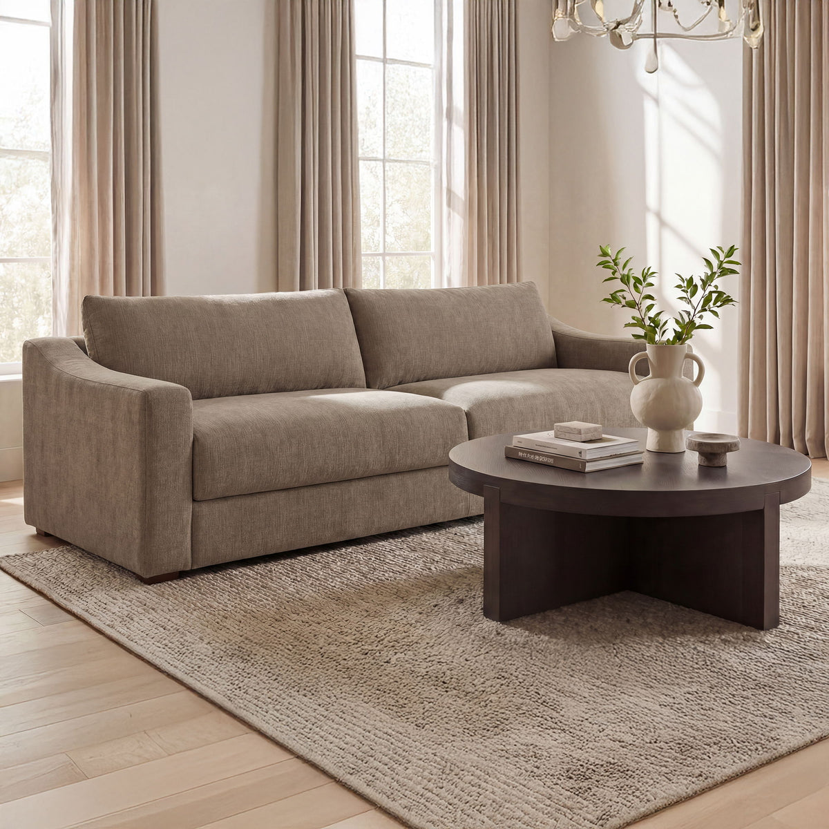 Taupe upholstered sofa with low arms and multiple back cushions