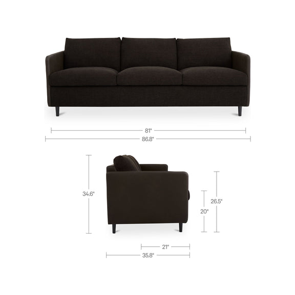 Dark warm black sofa with size diagram, three seat cushions, boxy back, tapered legs.