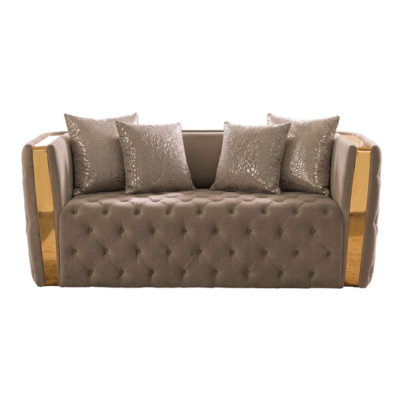 Light brown button-tufted loveseat with gold-tone sides and patterned throw pillows