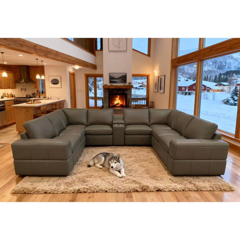 Dark green sectional sofa with large square arms and chaise-style corner seating