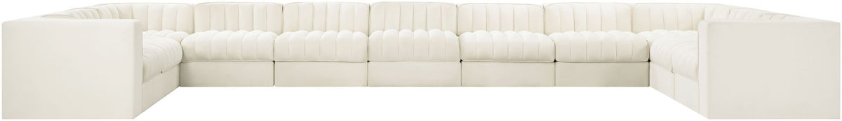 Velvet modular sectional sofa with tufted cushions, white upholstery, low block arms