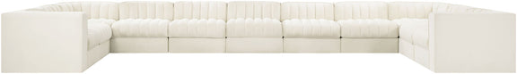 Velvet modular sectional sofa with tufted cushions, white upholstery, low block arms