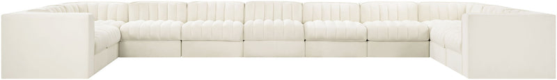 Velvet modular sectional sofa with tufted cushions, white upholstery, low block arms
