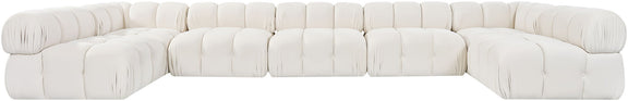 White U-shaped modular sectional sofa with tufted square cushions and rounded armrests