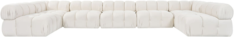 White U-shaped modular sectional sofa with tufted square cushions and rounded armrests