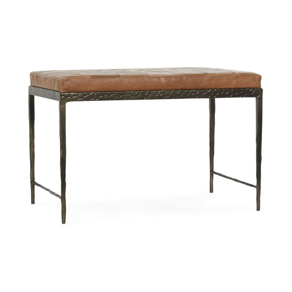 Brown leather bench with textured front skirt and padded seat on dark frame