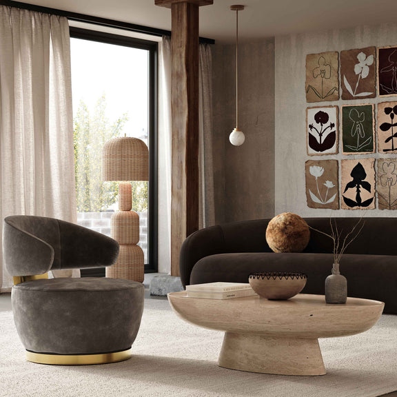Dark brown velvet sofa in living room setting, rounded arms and back