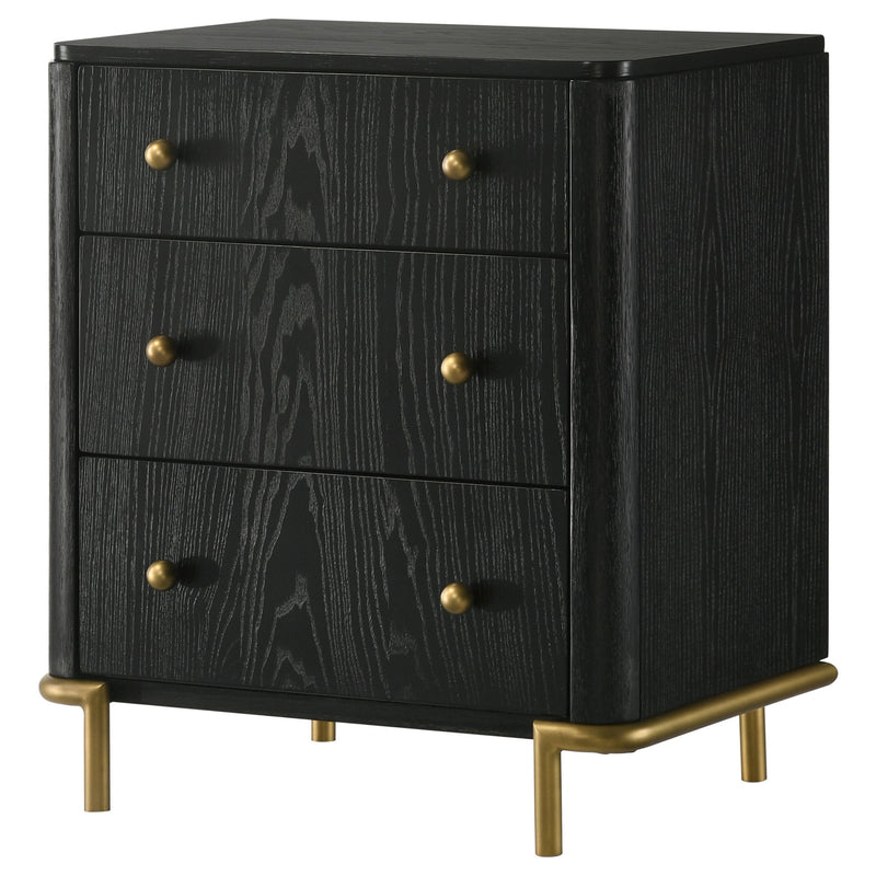 Black 3-drawer nightstand with gold-tone knobs and tapered legs, angled front