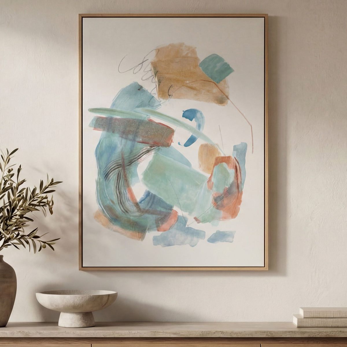 Multicolor abstract framed painting on wall, gold frame with blue, teal, and tan marks