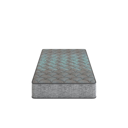 Firm hybrid mattress with quilted dark gray cover and teal-toned top pattern