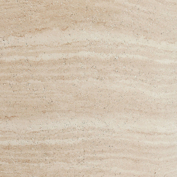Outdoor round concrete table top, travertine finish showing speckled aggregate detail.