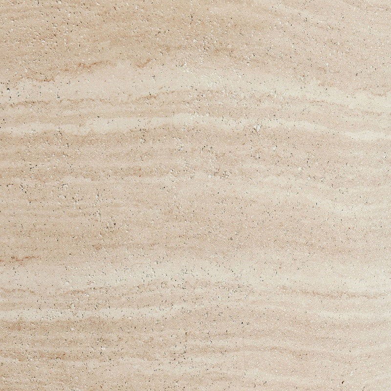 Outdoor round concrete table top, travertine finish showing speckled aggregate detail.