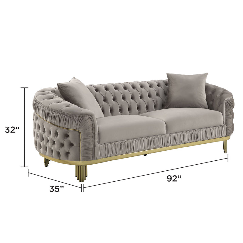 Gray tufted sofa, 92 in wide, 32 in high; gold legs and accent trim