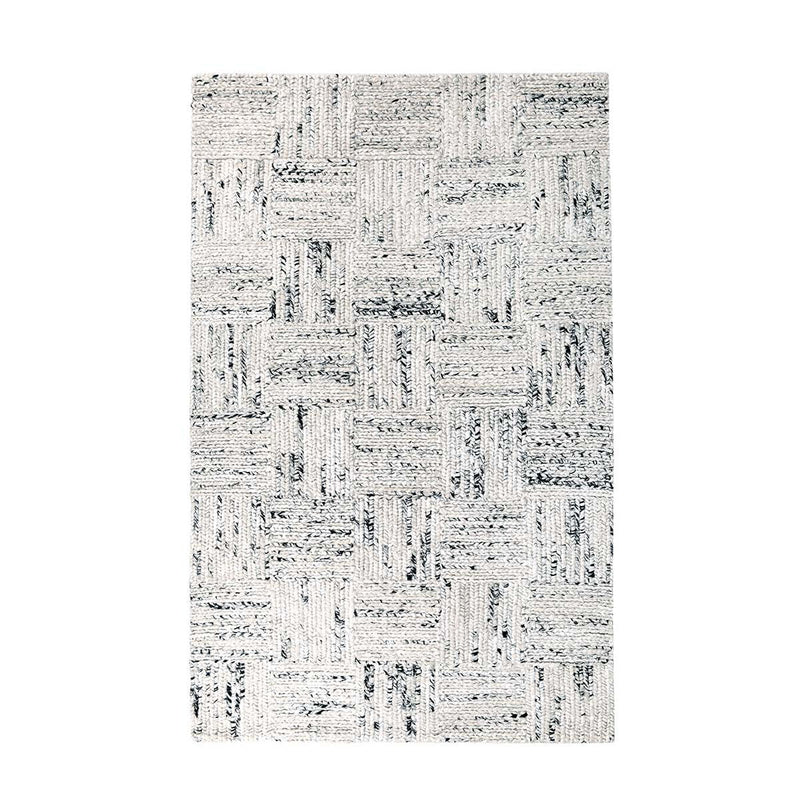 Ivory textured area rug with distressed geometric block design and dark gray accents