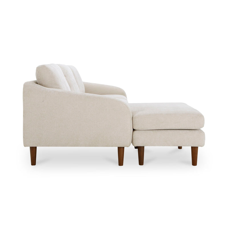 Oatmeal chaise sectional with rounded armrest and matching ottoman