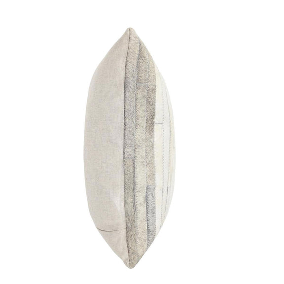 Tan multi hide pillow side view with textured hide panels and stitched edges