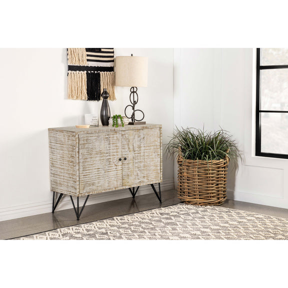 Two-door accent storage cabinet with distressed light wood panels and black metal legs