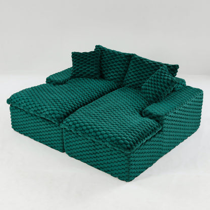 Dark green double chaise lounge with textured upholstery and two back cushions