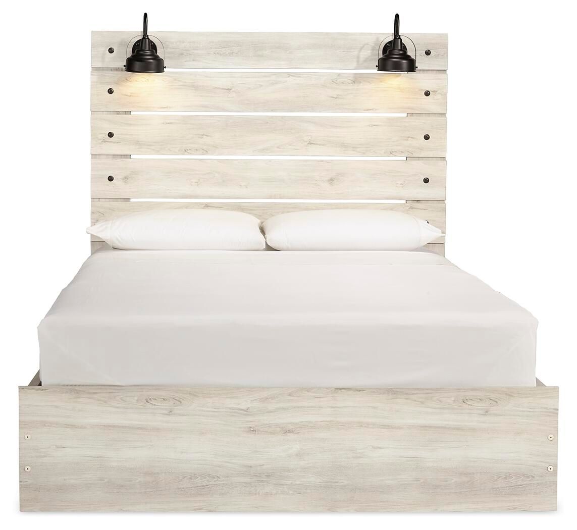 Cambeck panel bed with panel headboard, light wood base, and neatly fitted white mattress
